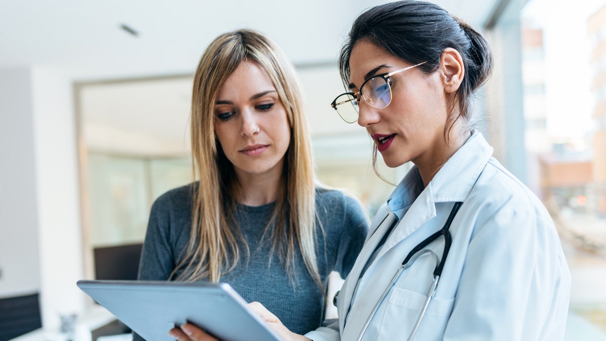 The doctor is talking to the patient 