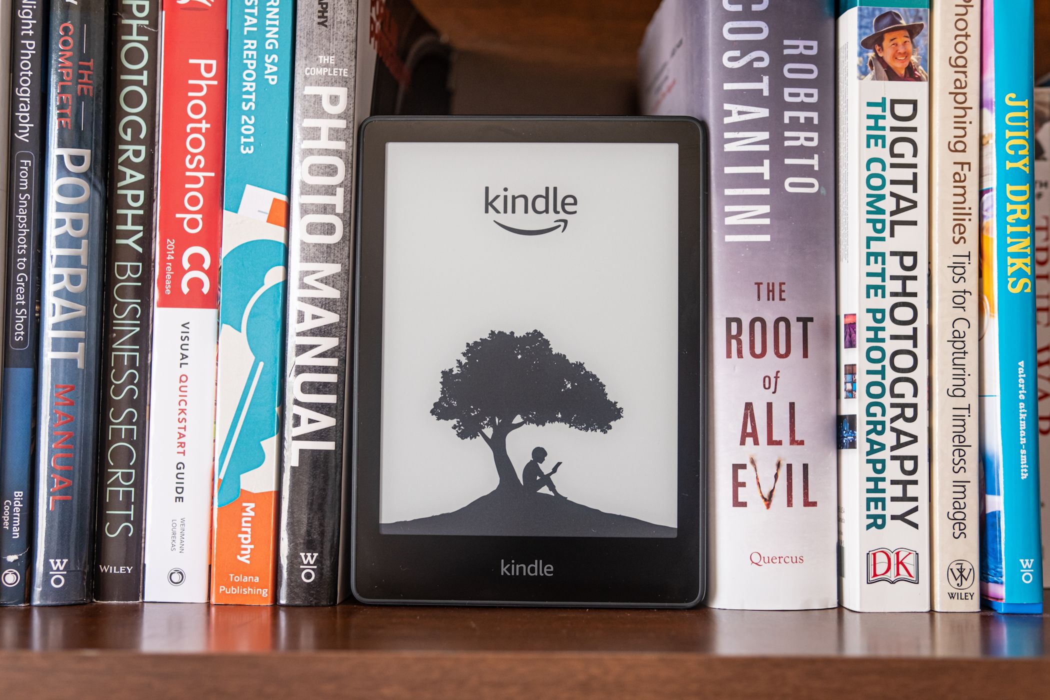 amazon is burning a bookshelf with real books