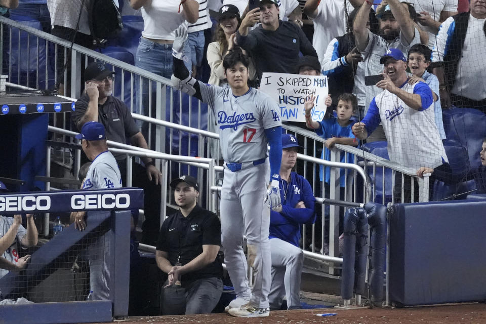 Los Angeles Dodgers' Shohei Ohtani (17) waves to fans after hitting a home run off Andy Pages, during the seventh inning of a baseball game against the Miami Marlins, Thursday, Sept. 19, 2024, in Miami . (AP Photo/Wilfredo Lee)